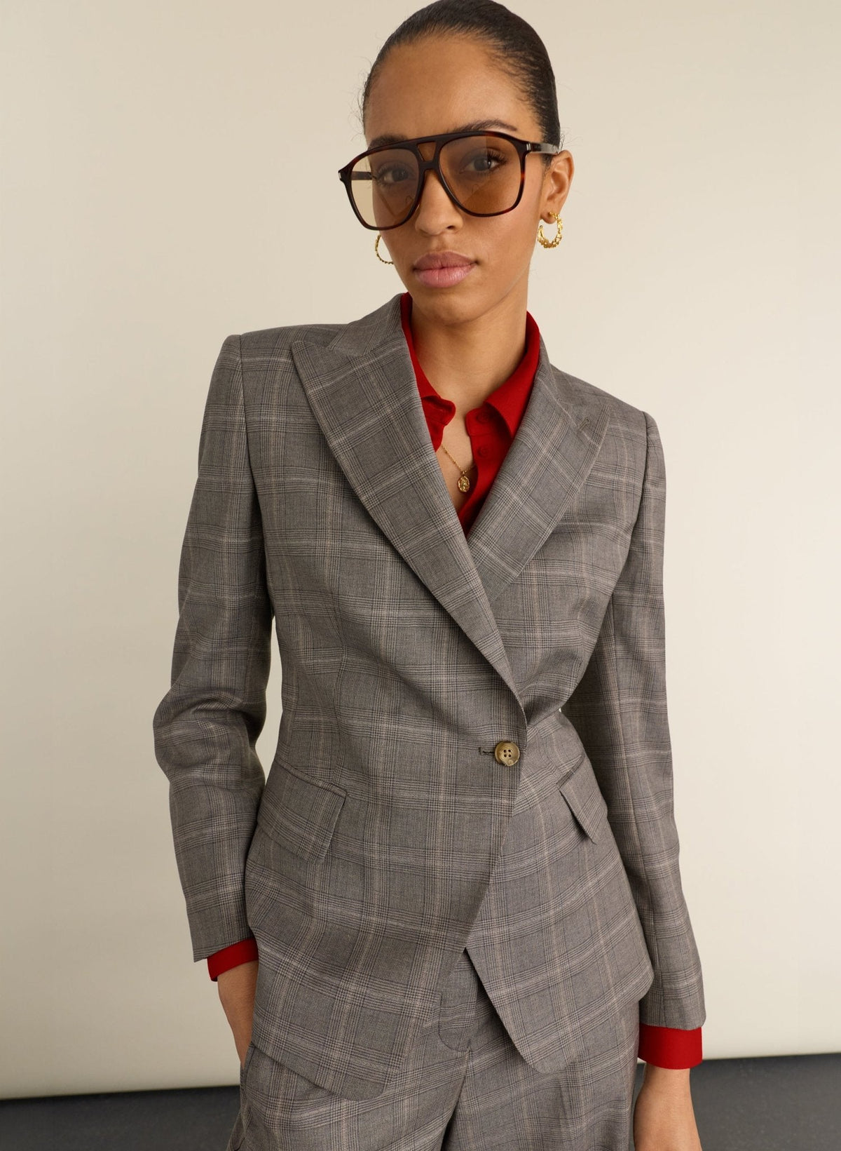 Grey and taupe checked cinched-waist blazer.