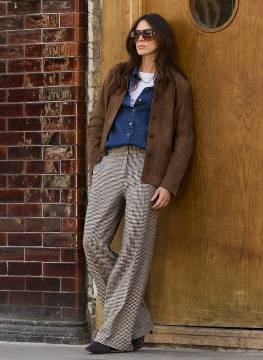 Beige and brown houndstooth trousers.