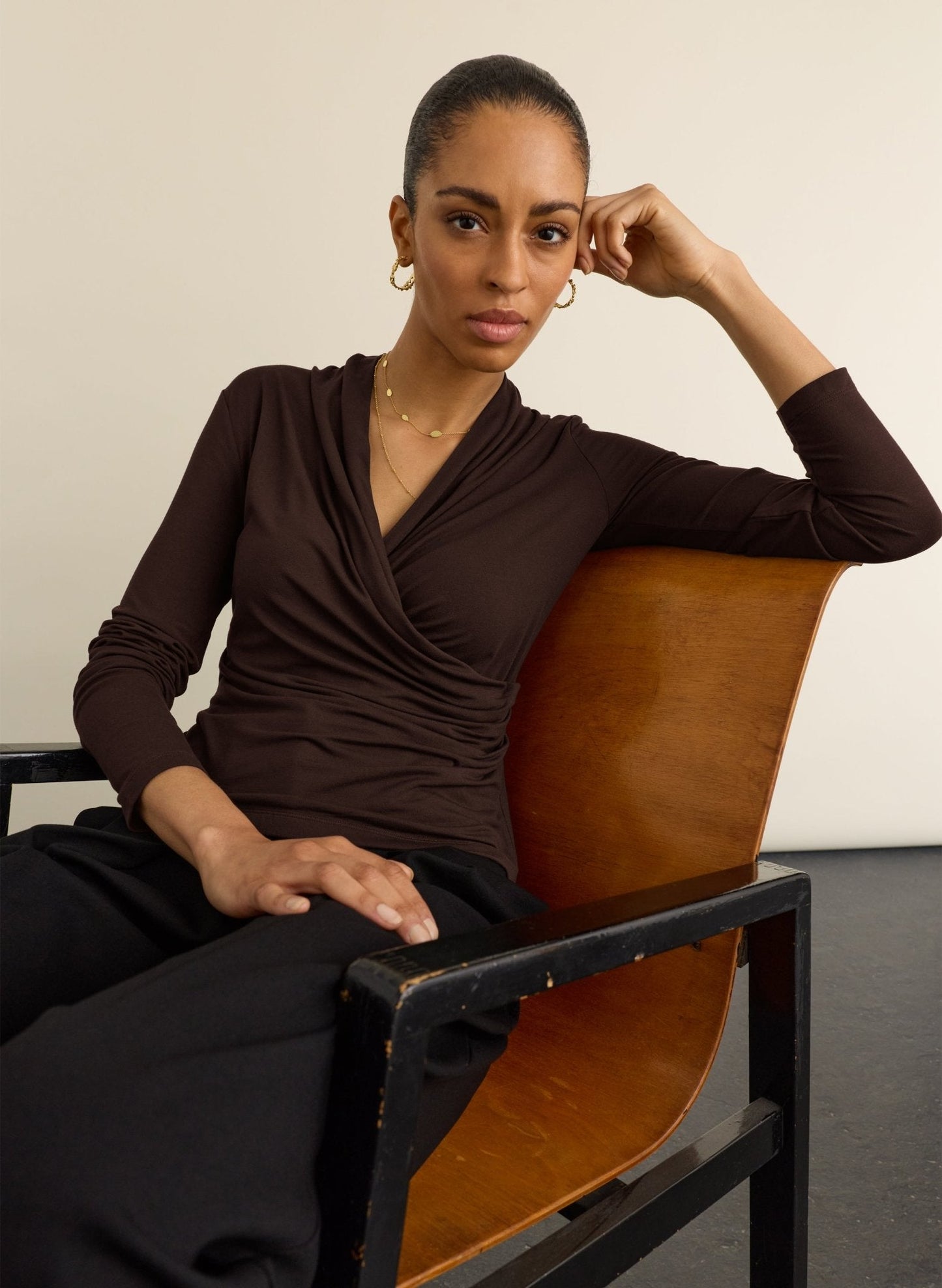 Long sleeved dark chocolate wrap top.