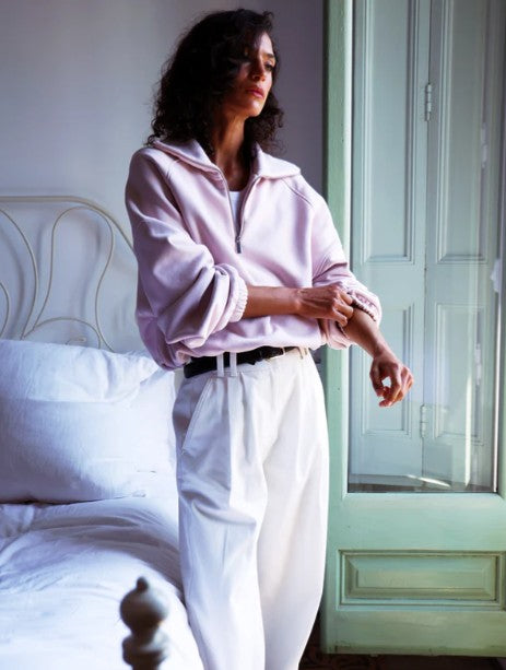 Dusk pink half-zip sweatshirt.