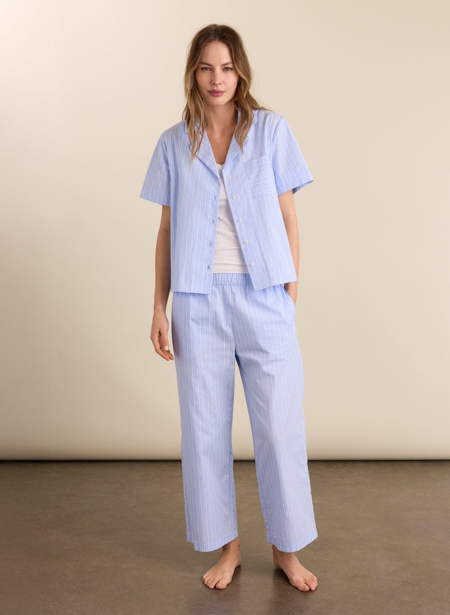 Soft blue and white striped organic cotton pyjama trousers.