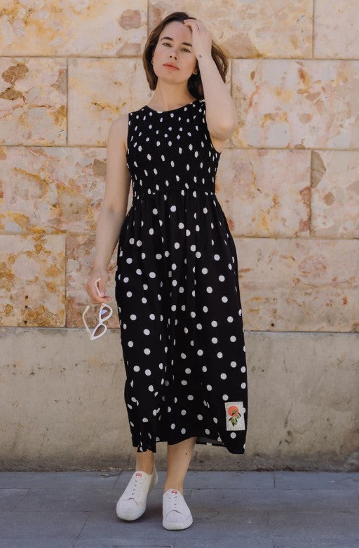 Black polka dot midi dress with shirred bodice.