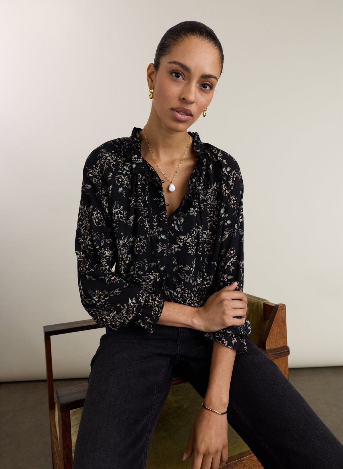 Black floral print viscose blouse.