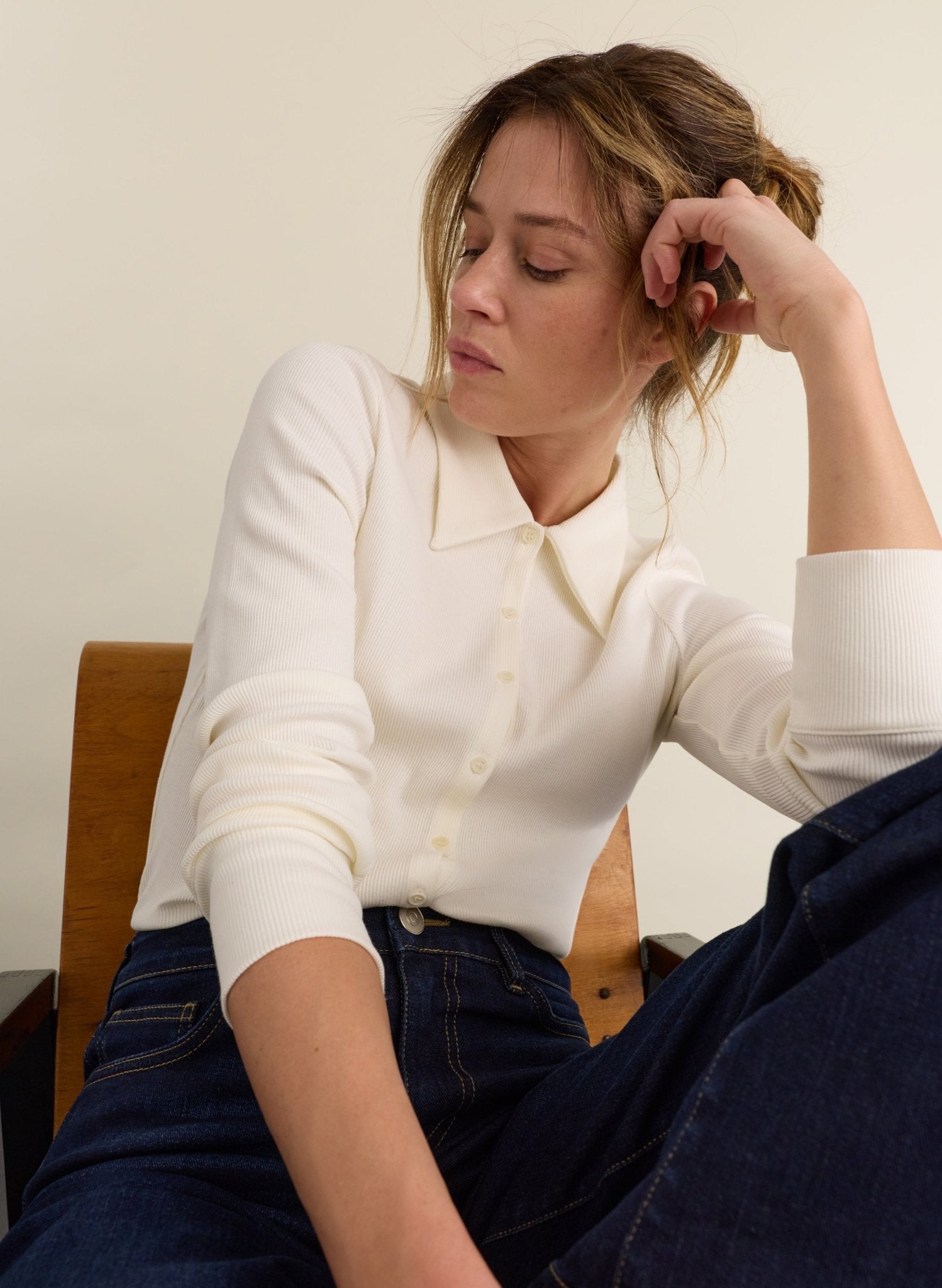 Cream long sleeved ribbed jersey top with collar.