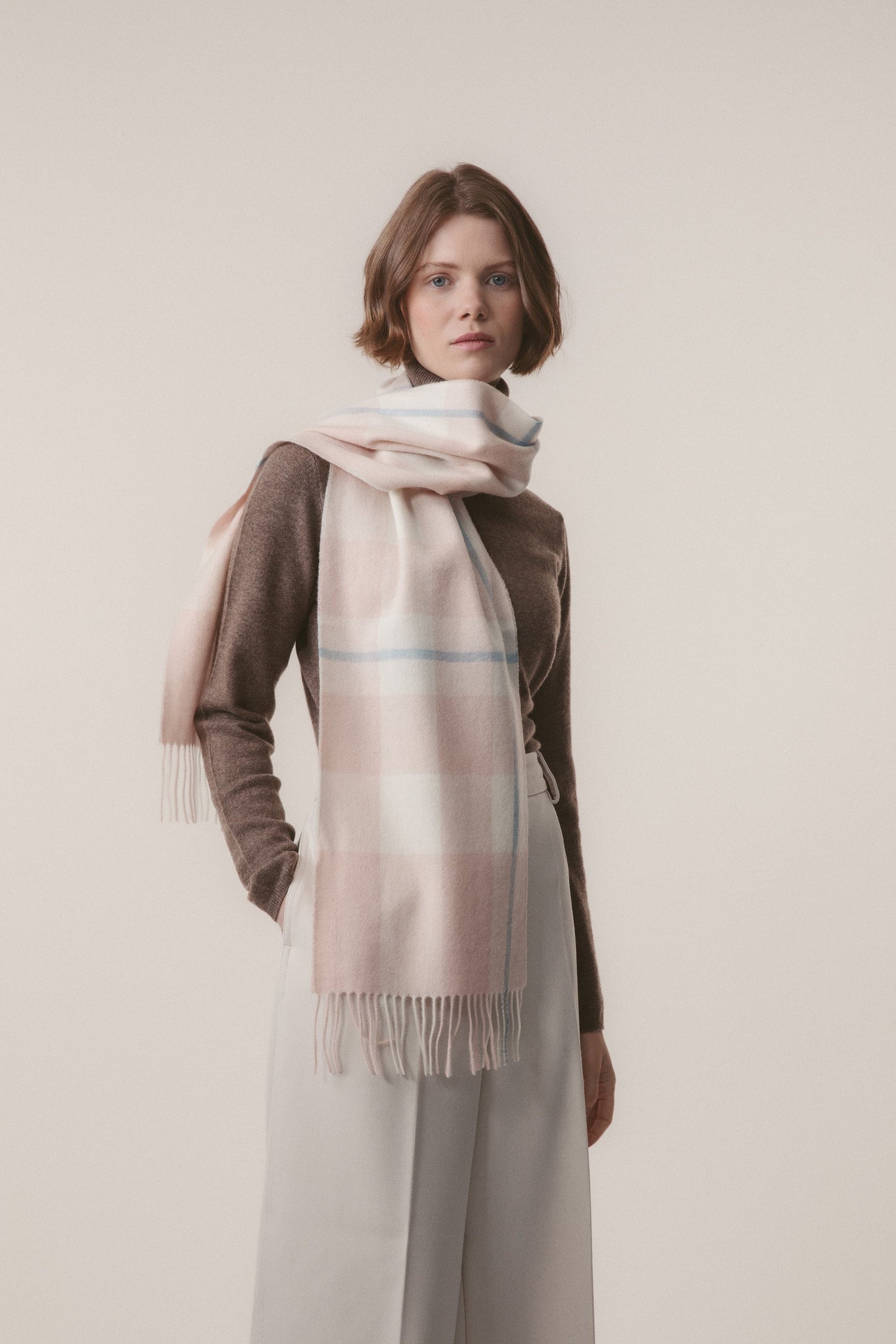 Beige and pink checked lambswool scarf.