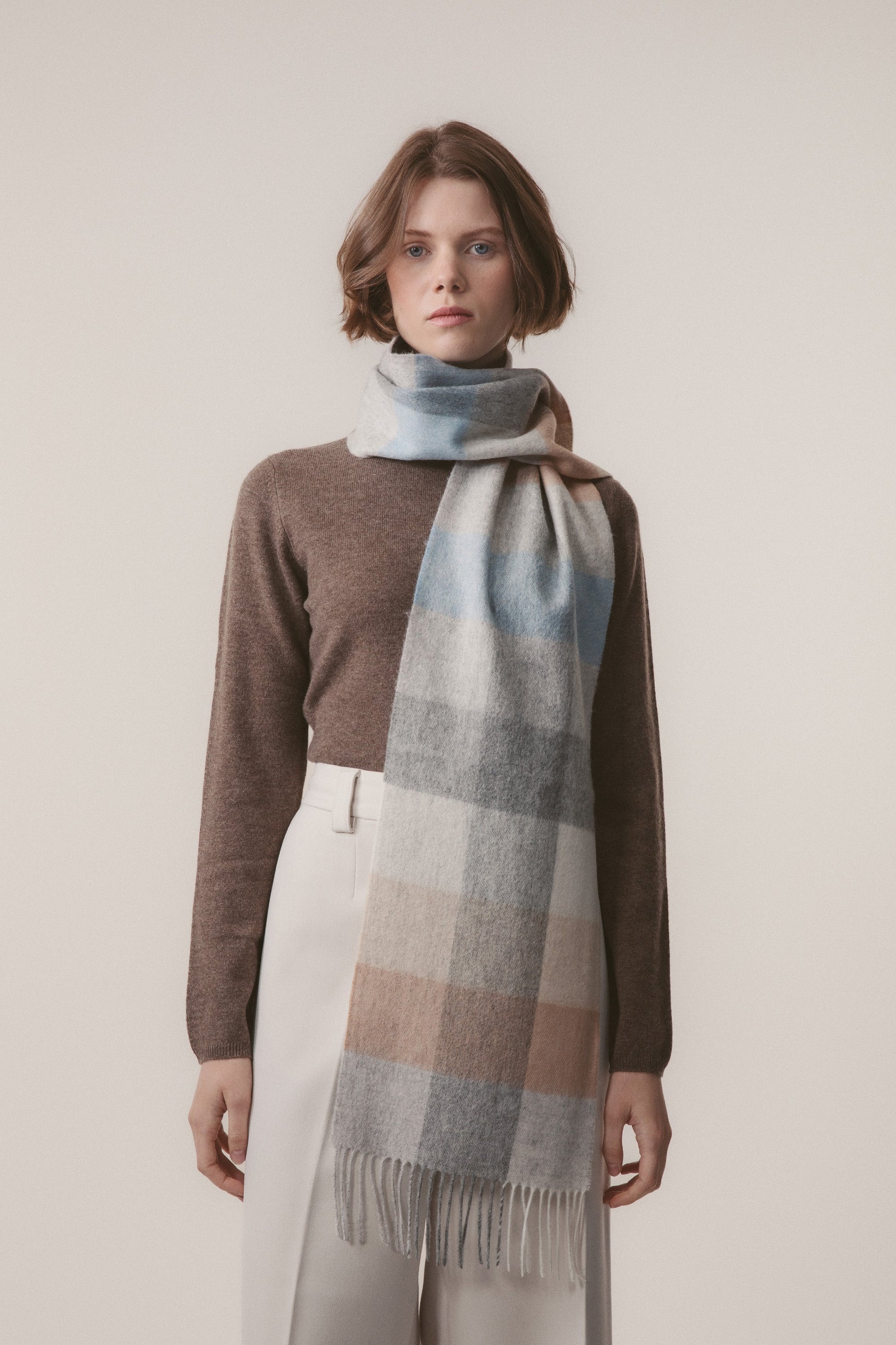 Soft blue, grey, and beige checked lambswool scarf by Kiltane.