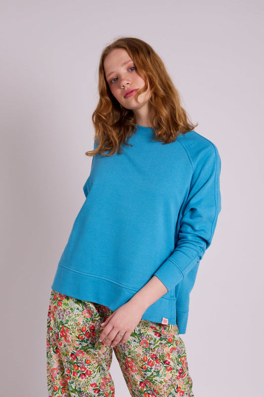Bright sky blue sweatshirt with crew neckline, long sleeves, and relaxed fit.