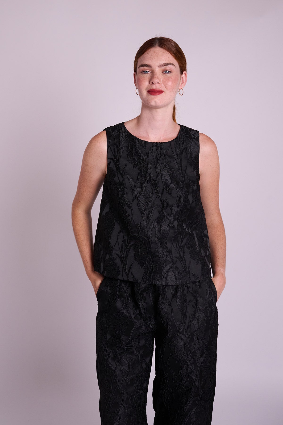 Black jacquard sleeveless top.