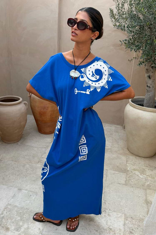 Cobalt blue maxi dress with white contrast print, short sleeves, and relaxed straight silhouette