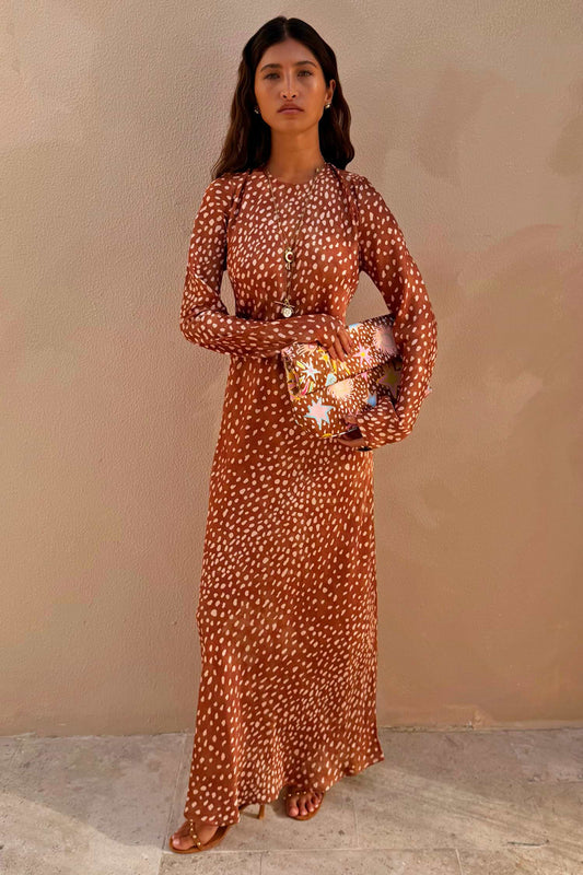 Brown polka dot long-sleeve maxi dress.