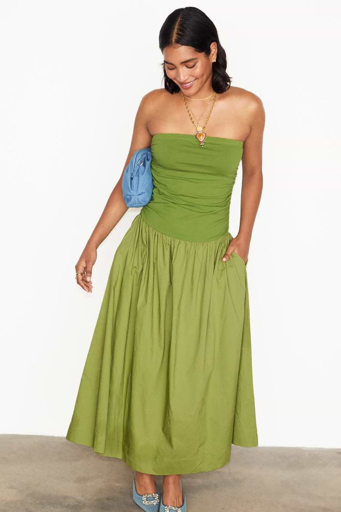 Mid-length pea green cotton midaxi dress with a fitted waistband and softly gathered silhouette.