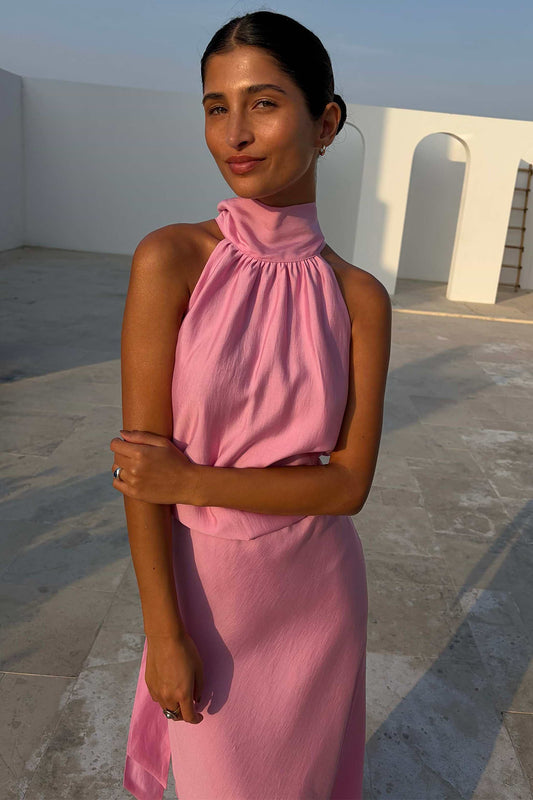 Light pink satin halterneck top.