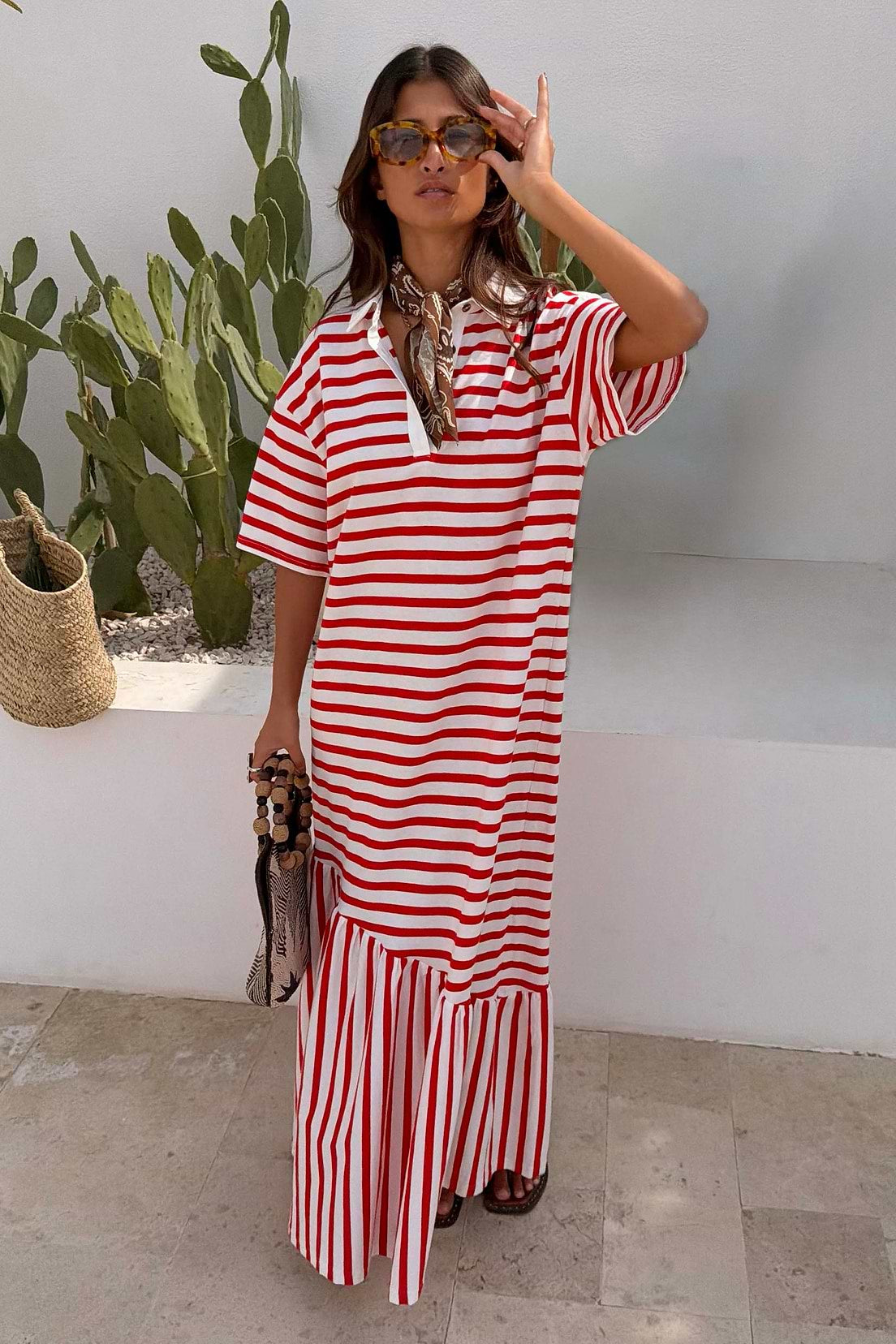 Red and white striped midi dress with short sleeves, a relaxed fit, and a tiered hem.
