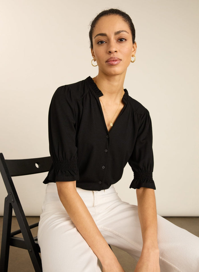Shoft sleeved caviar black pie-crust jersey blouse.