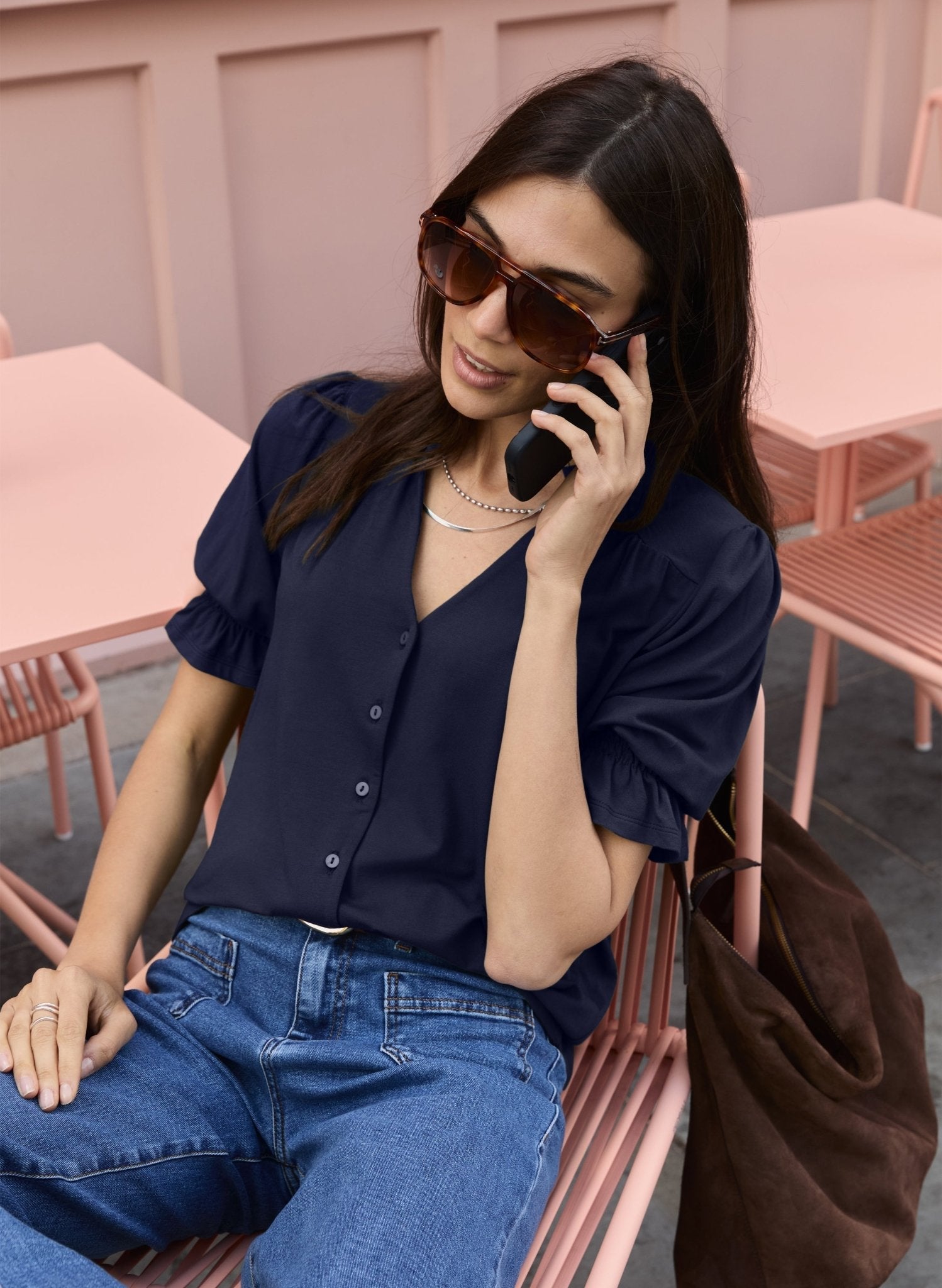Short sleeved navy blouse with pie crust collar.