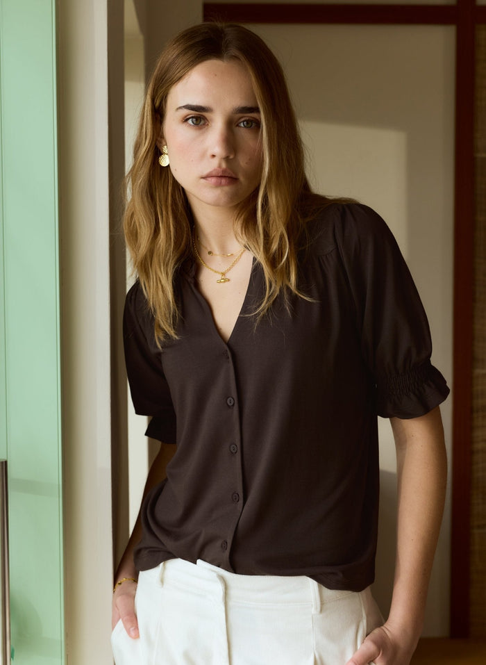 Chocolate brown jersey short sleeve blouse with pie-crust collar.