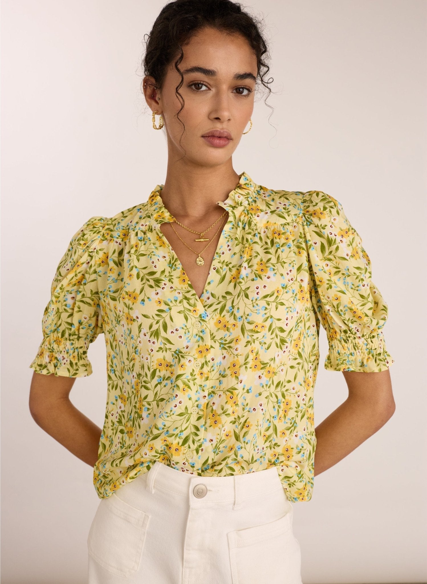 Yellow floral short sleeved blouse.