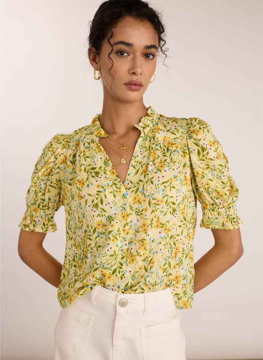 Yellow floral short sleeved blouse.