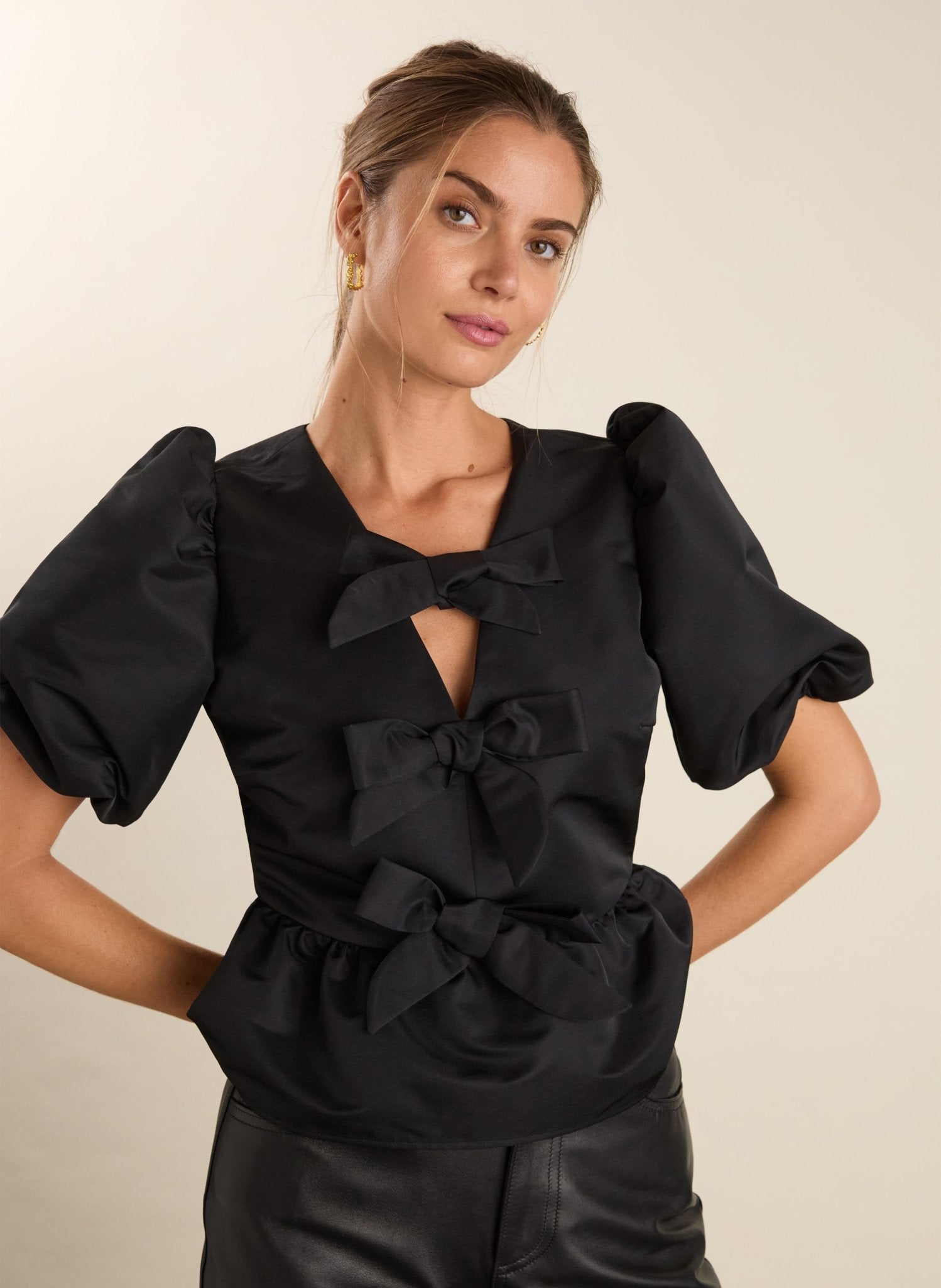 Black puff sleeve blouse with tie front.