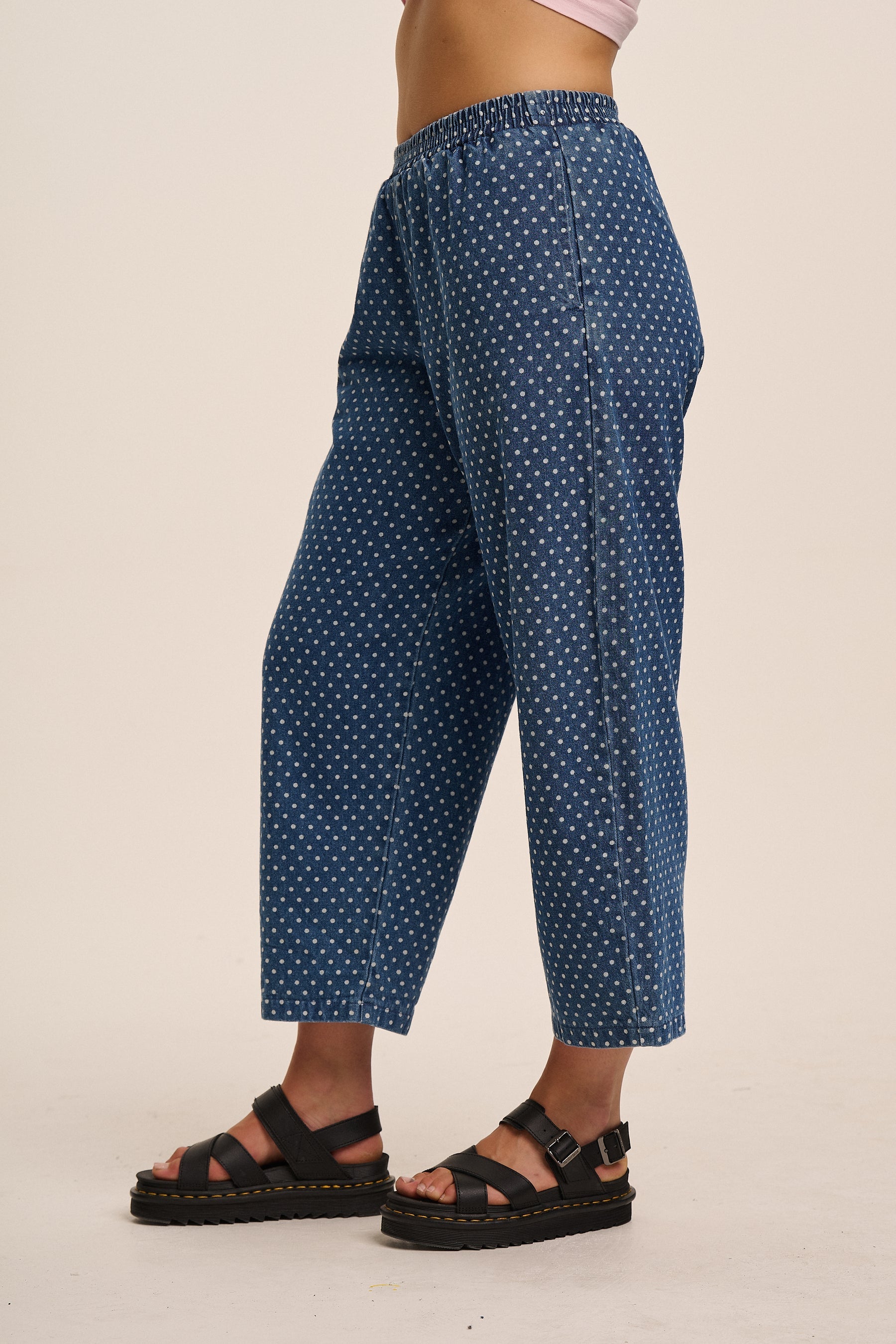 Polka dot denim trousers.