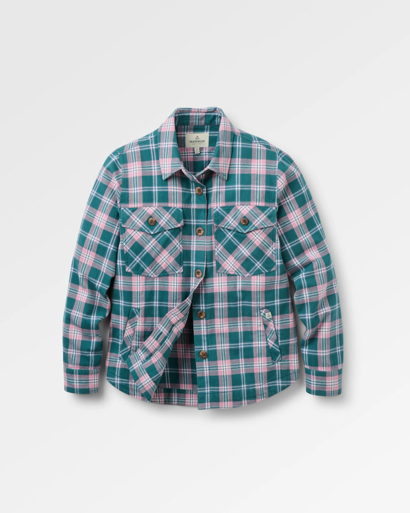 A long-sleeve plaid button-up shirt jacket in teal green, pink, and white, featuring two chest flap pockets and a diagonal front pocket detail, shown against a light grey background.