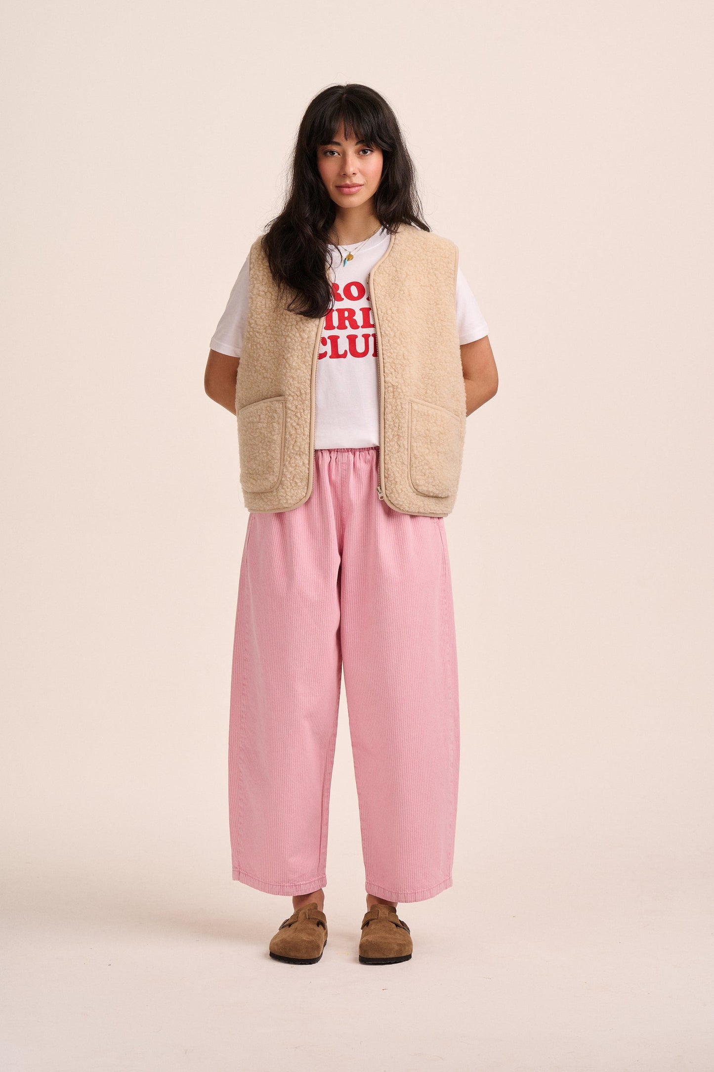Pink striped denim barrel leg jeans.