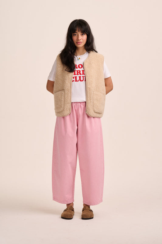Pink striped denim barrel leg jeans.
