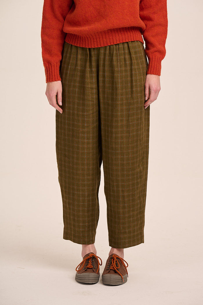 Khaki-olive checked linen tapered trousers.