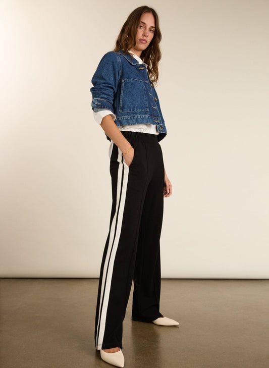 Black trousers with cream side stripe.