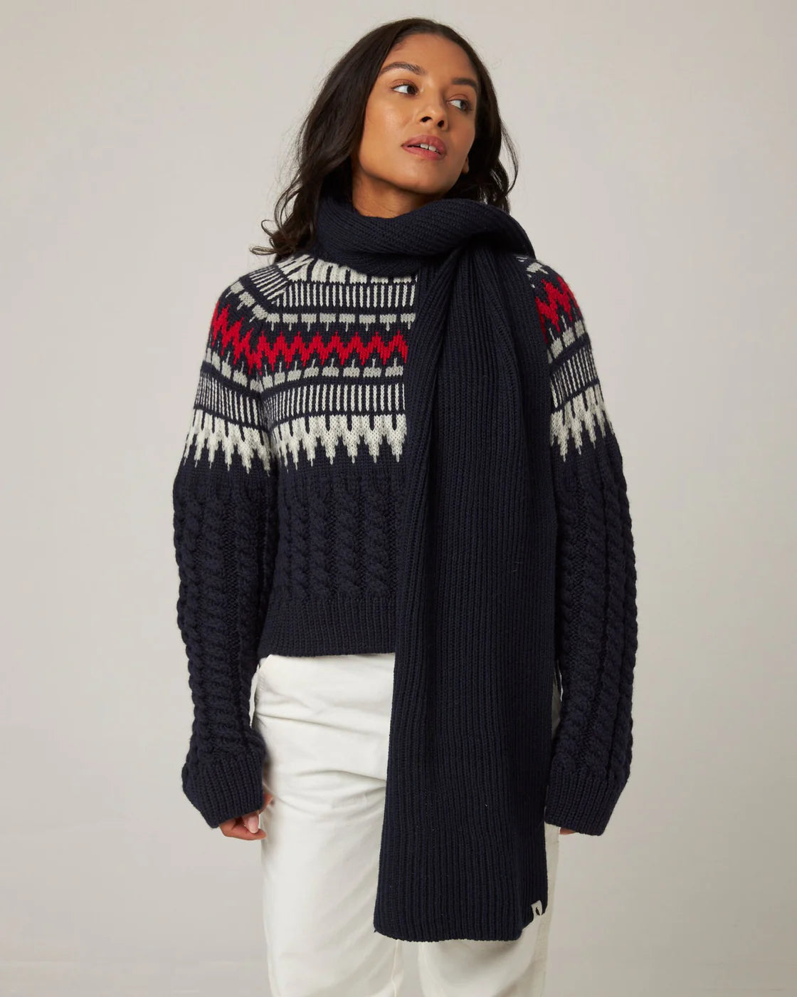 A deep navy ribbed knit merino wool scarf from Peregrine Clothing, filtered on Shop My Palette for the Deep Winter or Dark Winter colour season.