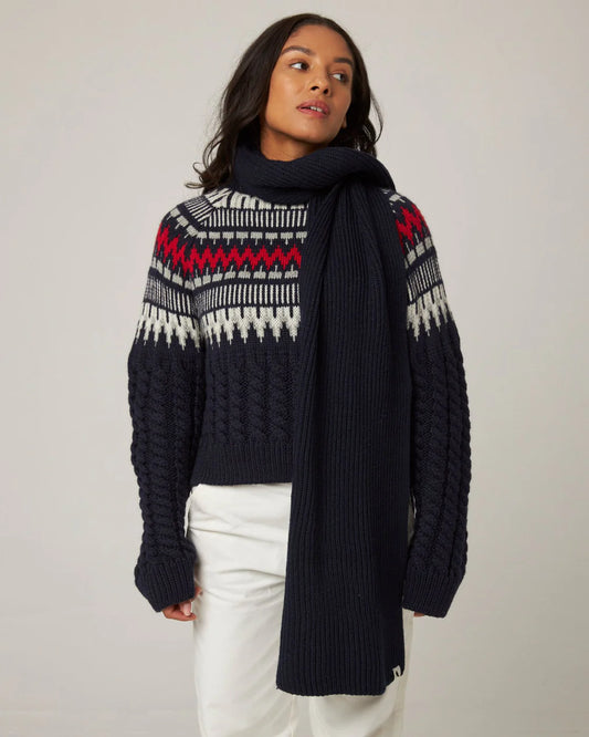 A deep navy ribbed knit merino wool scarf from Peregrine Clothing, filtered on Shop My Palette for the Deep Winter or Dark Winter colour season.