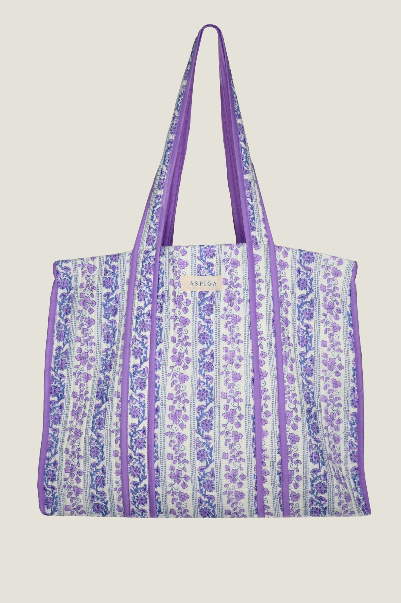Purple floral print tote bag with striped pattern and long shoulder straps.