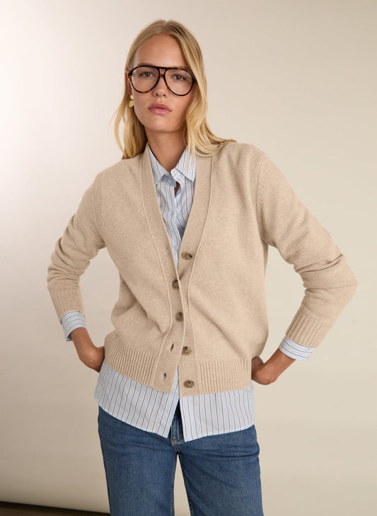 Soft sand coloured merino knit v-neck cardigan.