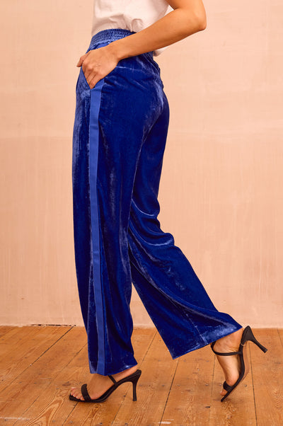 Azure blue velvet side stripe trousers.