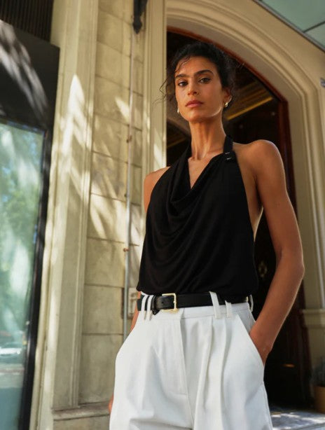 Black draped halterneck top.