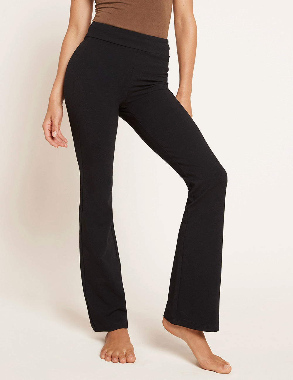 Black high waist flared trousers in bamboo fabric by Boody.