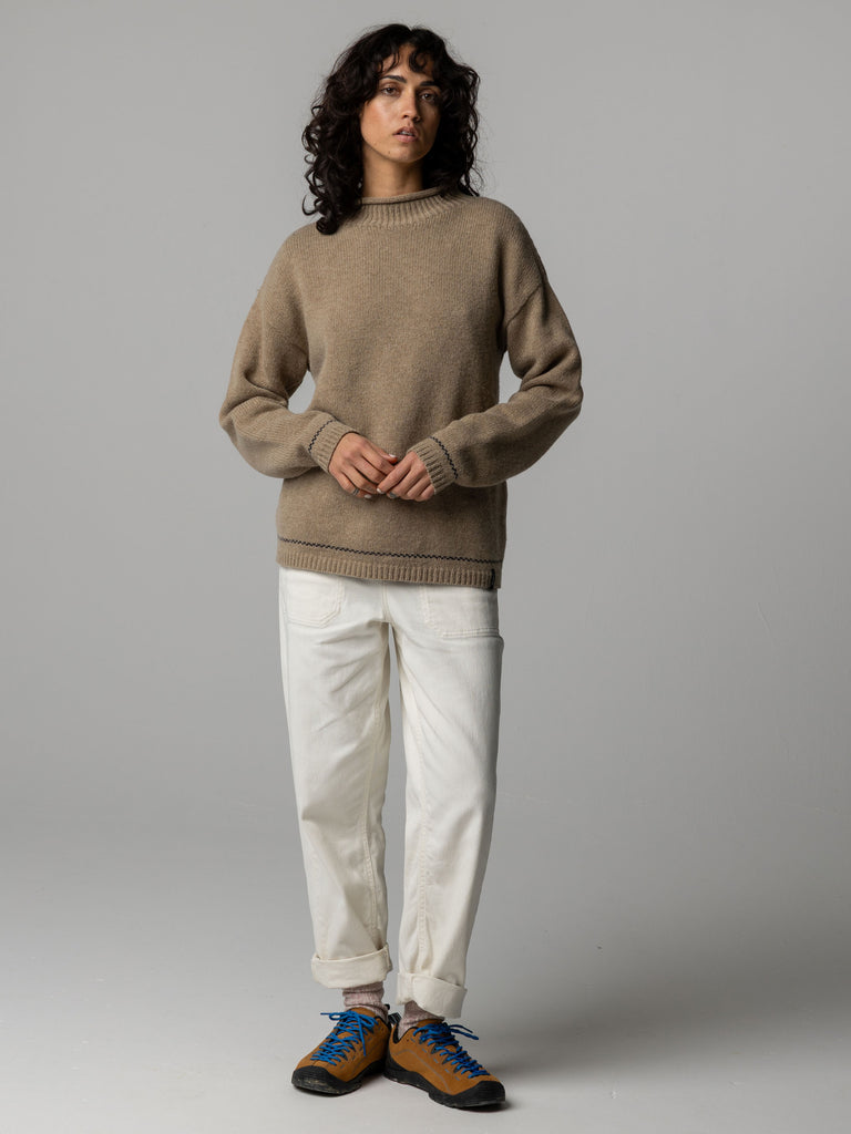 Oatmeal brown round neck wool blend jumper with contrast navy stitching.