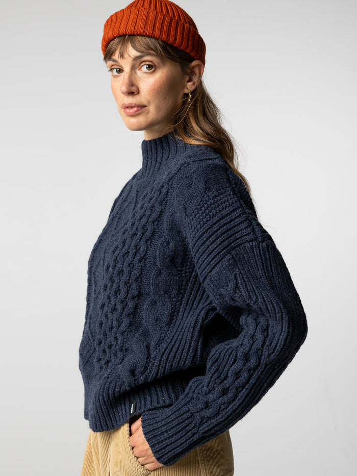 Indigo blue cable knit round neck jumper.