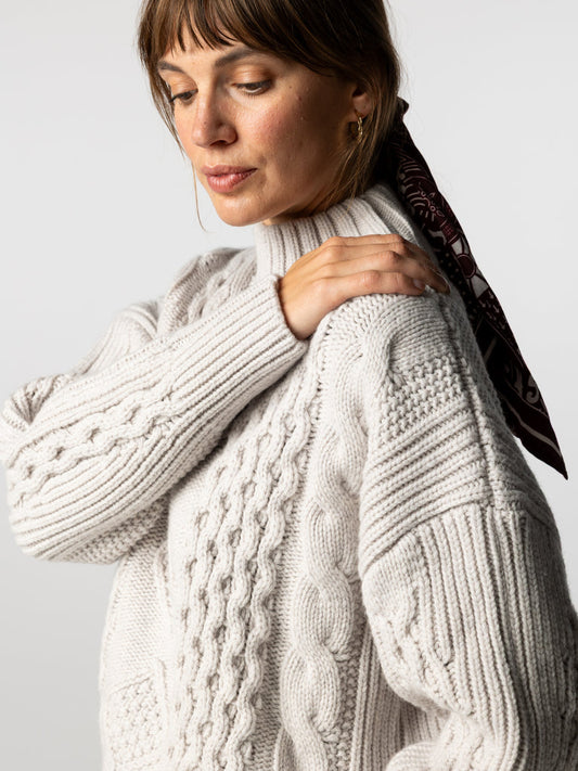 Dove grey cable knit high neck jumper.